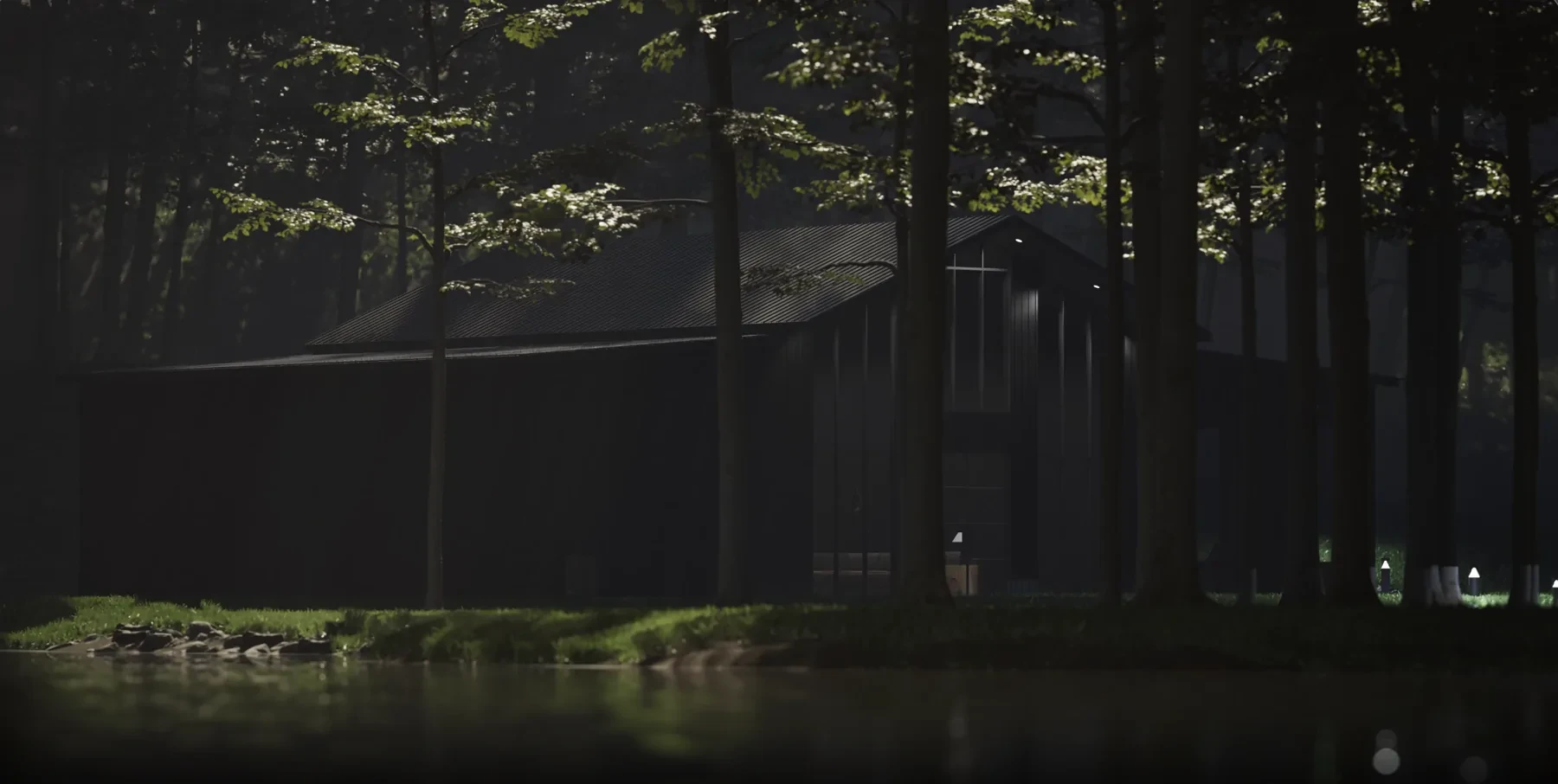 Modern mountain barndominium at night